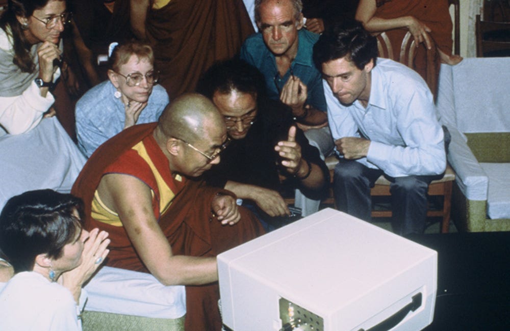 a picture of the Dalia Lama with a group of people