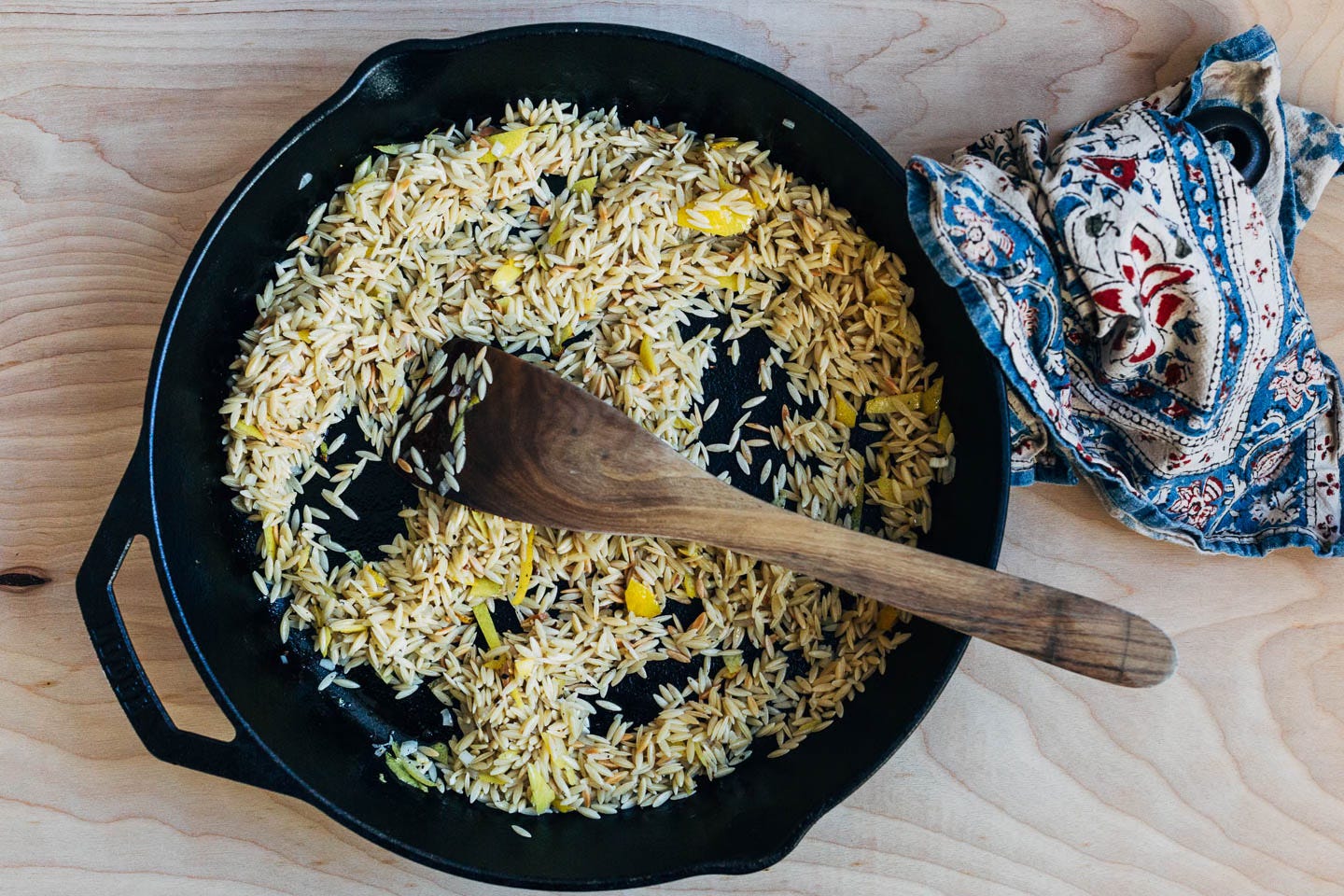 Orzo toasting in a cast iron skillet