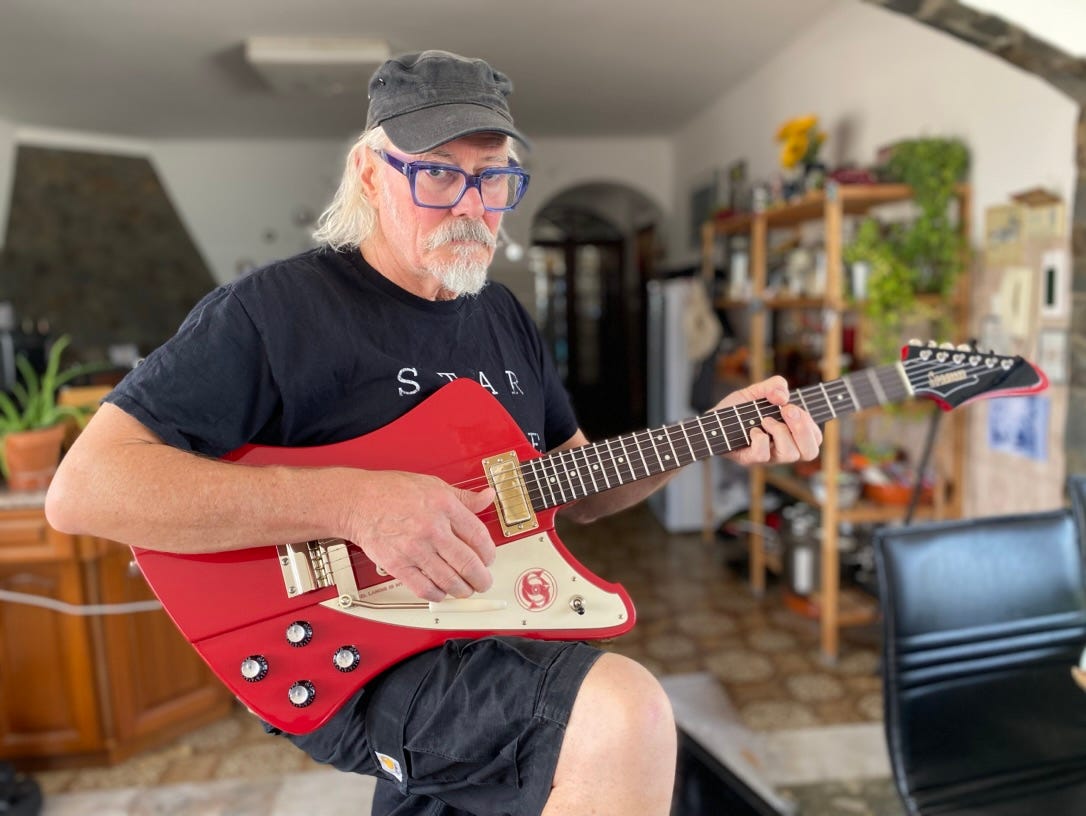 Simon Campbell with his new custom Firehawk guitar from Springer Guitars, France