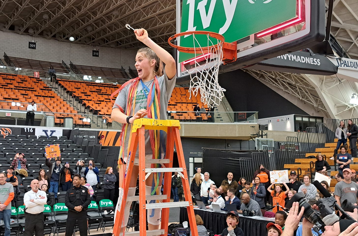 Princeton’s Ellie Mitchell cuts a piece of the net after winning the Ivy League tournament on March 11, 2023. (Photo by Adam Zielonka)