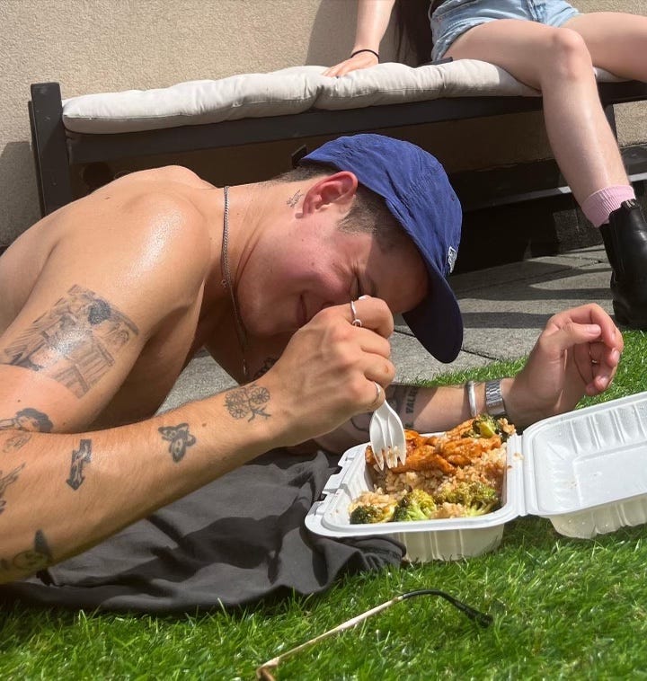 Damien Kronfeld eating outdoors