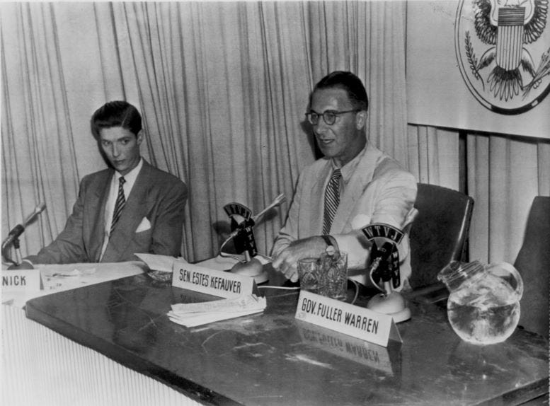 Ralph Renick moderating a debate between Senator Estes Kevauver and Florida Governor Fuller Warren on May 6, 1952.