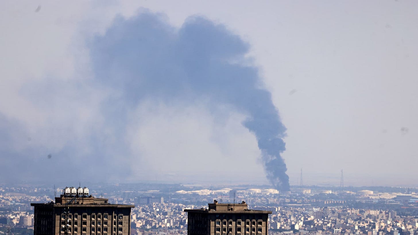 TOPSHOT - Smoke billows in the distance from an oil refinery following an Israeli strike on the Iranian capital Tehran on June 17, 2025. Israel and Iran exchanged fire again, the fifth day of strikes in their most intense confrontation in history, fuelling fears of a drawn-out conflict that could engulf the Middle East. (Photo by ATTA KENARE / AFP) (Photo by ATTA KENARE/AFP via Getty Images) TOPSHOT - Smoke billows in the distance from an oil refinery following an Israeli strike on the Iranian capital Tehran on June 17, 2025. Israel and Iran exchanged fire again, the fifth day of strikes in their most intense confrontation in history, fuelling fears of a drawn-out conflict that could engulf the Middle East. (Photo by ATTA KENARE / AFP) (Photo by ATTA KENARE/AFP via Getty Images)