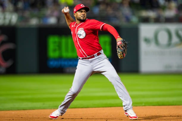 Jeimer Candelario of the Cincinnati Reds throws the ball to first base during the Spring Training Game against the Texas Rangers at Surprise Stadium...