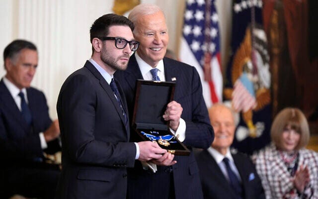 US President Joe Biden, right, presents the Presidential Medal of Freedom, the highest US civilian honor, to Alex Soros on behalf of his father George Soros, in the East Room of the White House, January 4, 2025, in Washington. (AP Photo/Manuel Balce Ceneta)