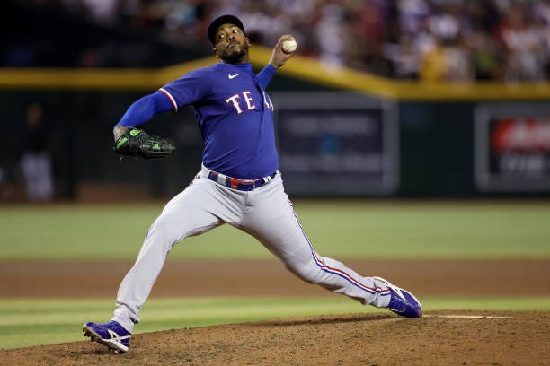 Aroldis Chapman of the Texas Rangers pitches in the seventh inning against the Arizona Diamondbacks during Game Five of the World Series at Chase...