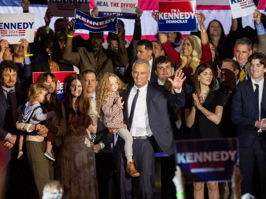 Robert F. Kennedy Jr. is joined by family and supporters onstage after announcing his candidacy for president.