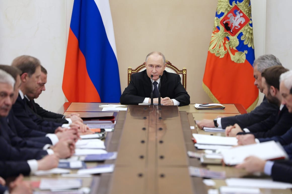Russian President Vladimir Putin chairs a meeting of the Military-Industrial Commission