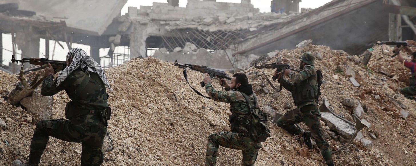 In this Dec. 5, 2016 file photo, Syrian army soldiers fire their weapons during a battle with rebel fighters at the Ramouseh front line, east of Aleppo, Syria. - Sputnik International, 1920, 07.12.2024