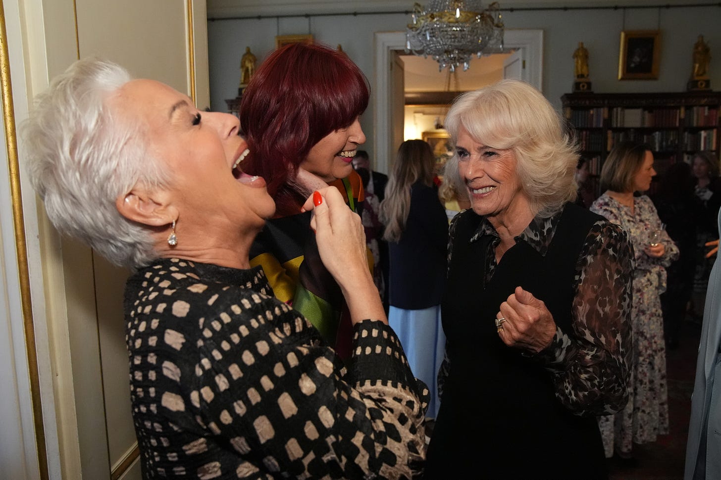 Queen Camilla laughing with guests Queen Camilla laughing with guests
