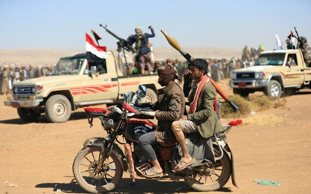 Yemeni rebels demonstrate in the suburbs of the Houthi-controlled capital Sana'a, on December 23, 2024. (Photo by Mohammed HUWAIS / AFP)