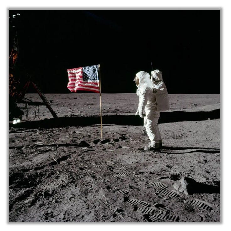 Buzz Aldrin is pictured on the moon along with the American flag.