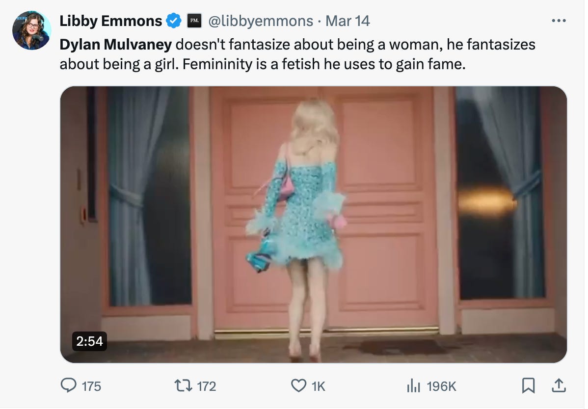 A beautiful blonde girl twirls in front of a pink door, under a TERF-y caption.