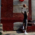 In this April 8, 2013 picture, a boy shoots a basketball into a makeshift basket made from a milk crate and attached to a vacant row house in Baltimore. The U.S. Census Bureau estimates that 20 percent of American children are impoverished. An estimated 16,000 buildings are vacant or abandoned in Baltimore. (AP Photo/Patrick Semansky) In this April 8, 2013 picture, a boy shoots a basketball into a makeshift basket made from a milk crate and attached to a vacant row house in Baltimore. The U.S. Census Bureau estimates that 20 percent of American children are impoverished. An estimated 16,000 buildings are vacant or abandoned in Baltimore. (AP Photo/Patrick Semansky)