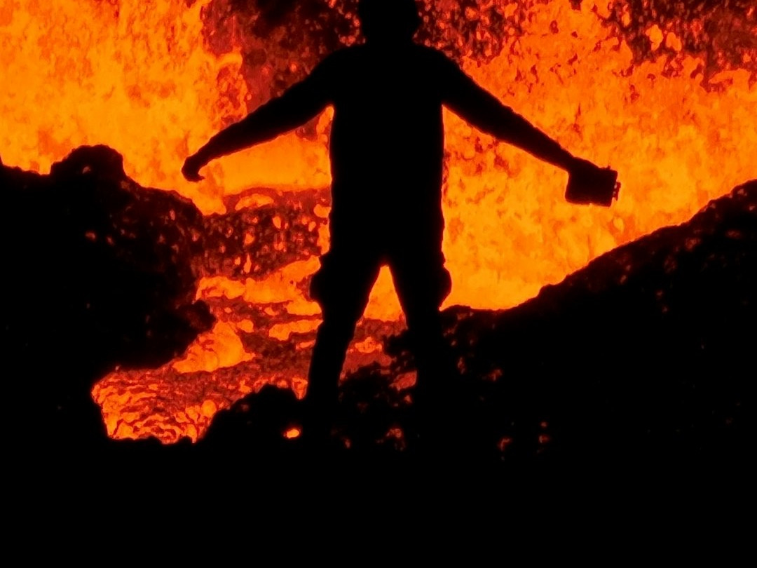 a person standing on a rock a person standing on a rock
