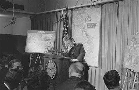 [Secretary of Defense, Robert McNamara standing at a podium in front of ...