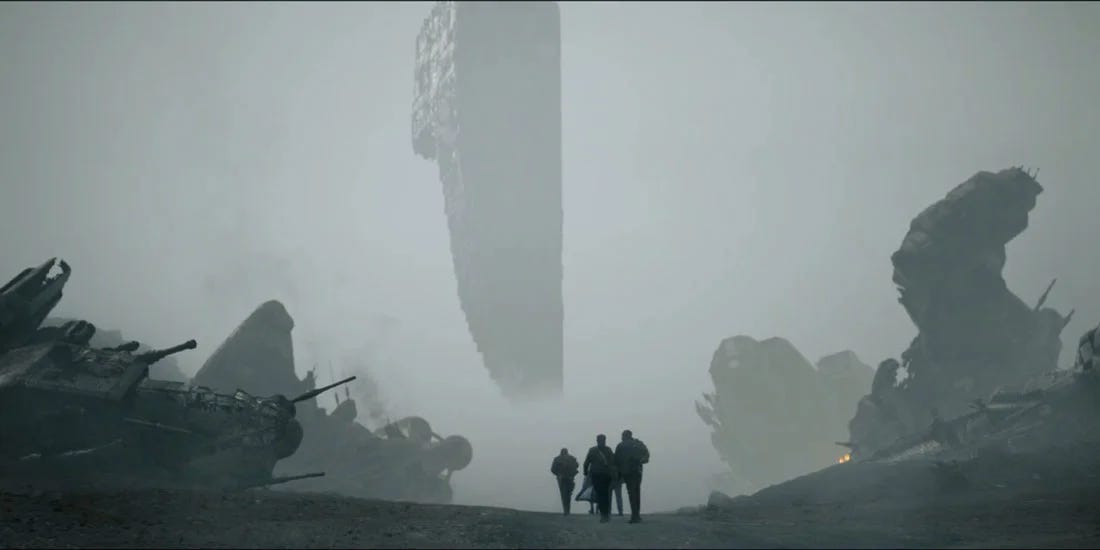 This image shows Team TARDIS walking amidst the devastation and debris of nine crashed spaceships on the surface of the planet Ranskoor Av Kolos as they approach the knife-like structure known as the Edifice, which floats above the planet's surface, in "The Battle of Ranskoor Av Kolos" (Doctor Who Series 11's tenth episode and season finale). This image shows Team TARDIS walking amidst the devastation and debris of nine crashed spaceships on the surface of the planet Ranskoor Av Kolos as they approach the knife-like structure known as the Edifice, which floats above the planet's surface, in "The Battle of Ranskoor Av Kolos" (Doctor Who Series 11's tenth episode and season finale).
