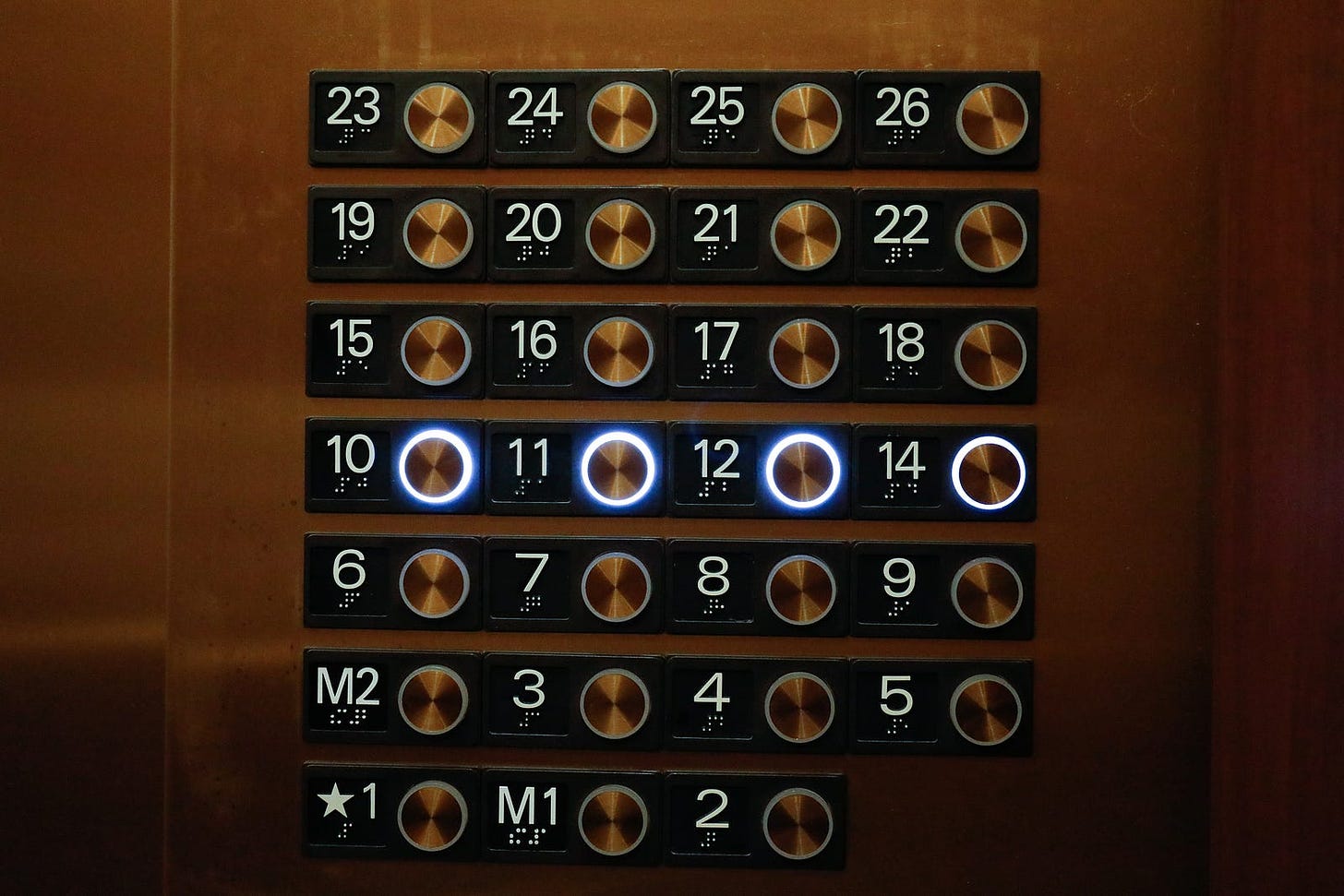 An elevator with a missing 13th floor button.