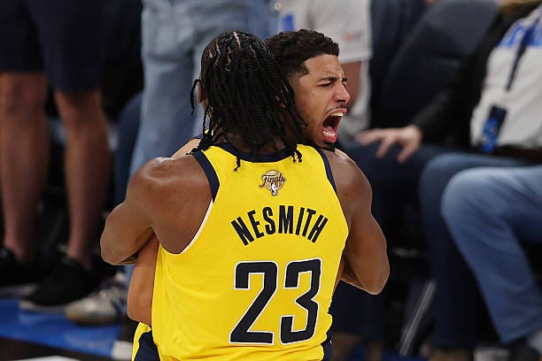 Tyrese Haliburton of the Indiana Pacers congratulated by Aaron Nesmith after scoring a basket against the Oklahoma City Thunder during the fourth...