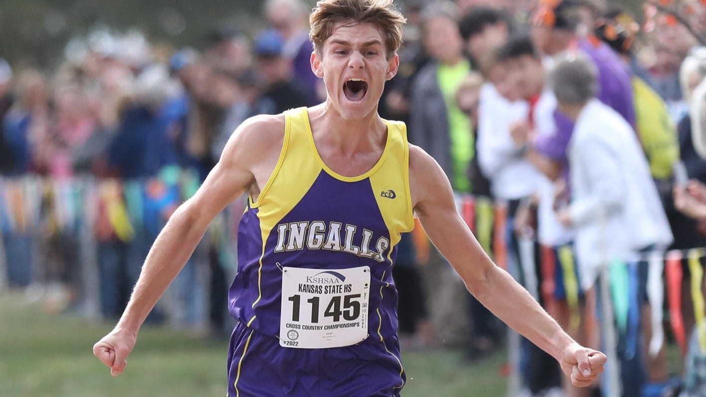 Ingalls senior Brenden Ellis celebrates near the finish line during the Class 1A boys cross country race Saturday in Wamego. Ellis won with a personal-best time of 16:50.13.