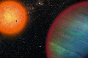 The WASP-132 system contains a Hot Jupiter (in the foreground), an inner super-Earth (here transiting in front of the orange host star) and the planet WASP-132d, discovered towards the outside of the system.