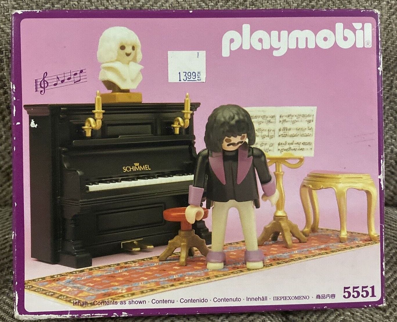 Vintage pink box of Victorian Playmobil piano set with piano and stool, rug, music, gold music stand, gold table, and figurine.