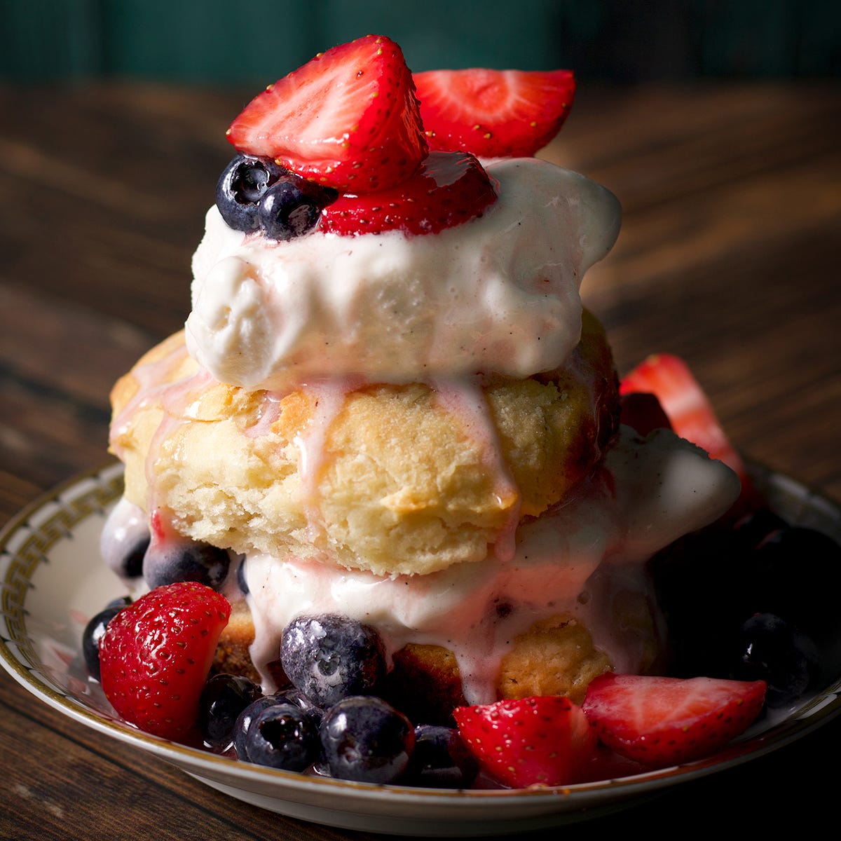 Strawberry shortcake made with Angel biscuits, fresh strawberries and blueberries, and vanilla ice cream.