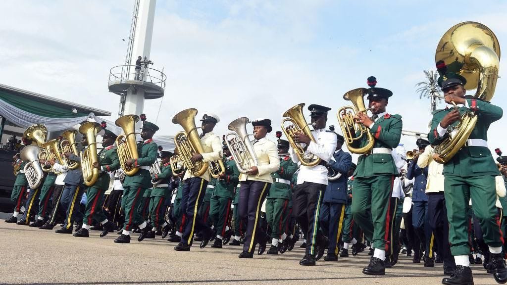 The military band plays musical instruments during celebrations marking Democracy Day in Abuja, on June 12, 2019