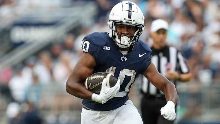 Penn State running back Nicholas Singleton carries the ball during the first quarter against the Kent State Golden Flashes at Beaver Stadium. 