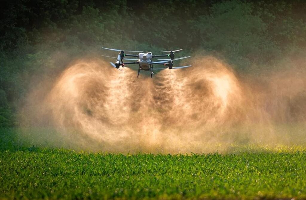 A drone spraying a crop

Description automatically generated