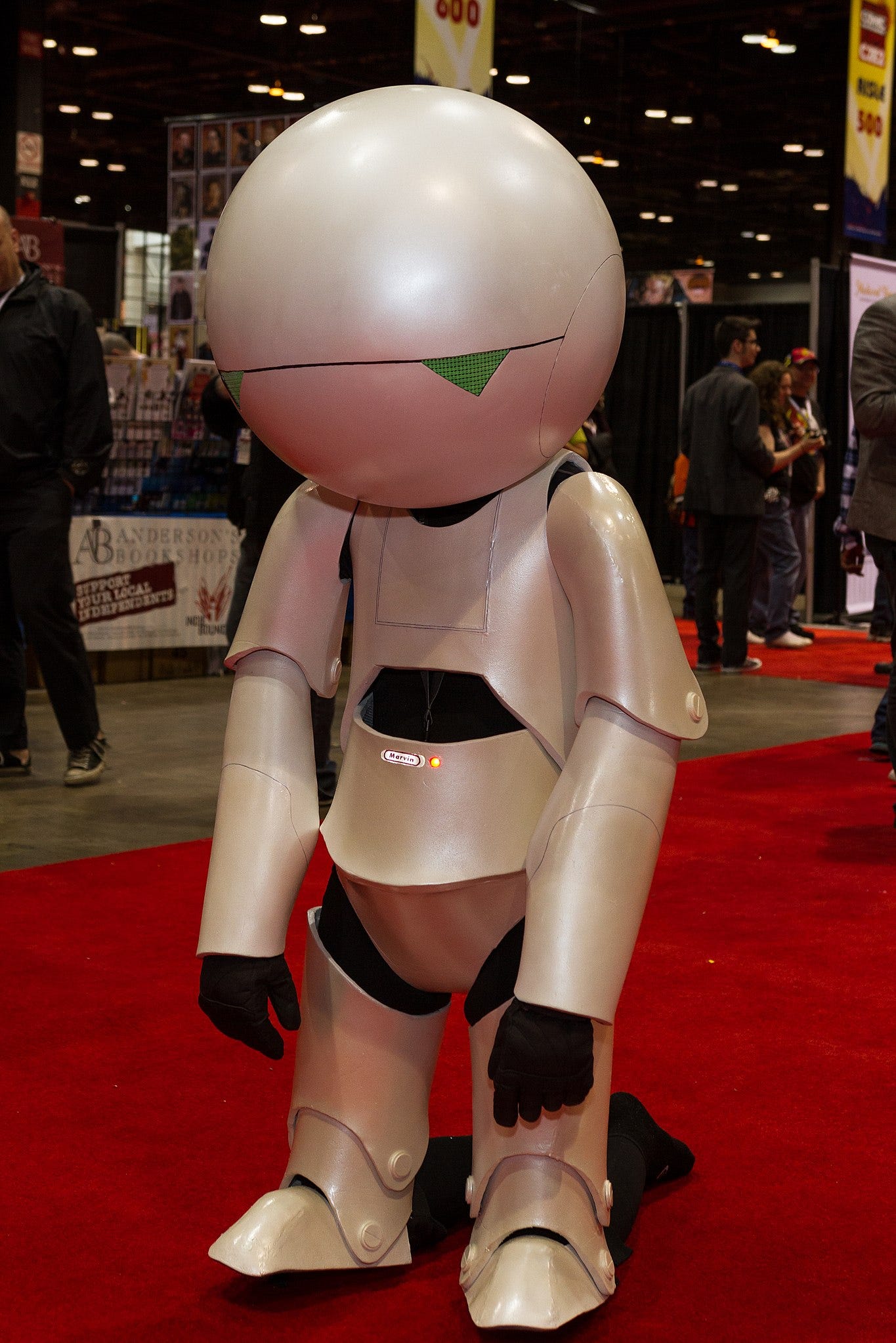 the movie version of Marvin the Paranoid Android, looking sad on a red carpet the movie version of Marvin the Paranoid Android, looking sad on a red carpet