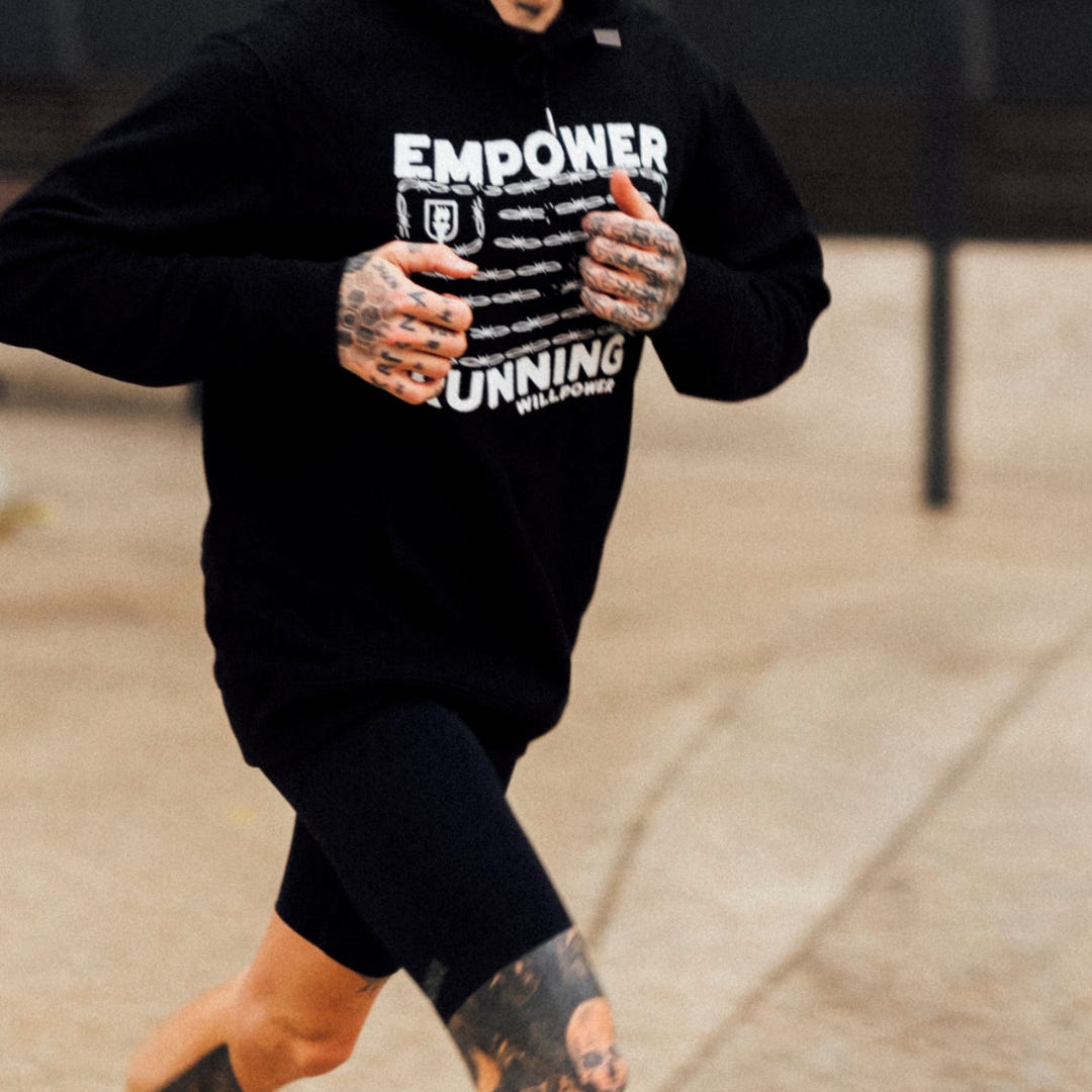 Runner wearing an "Empower Running" Sweater by Willpower