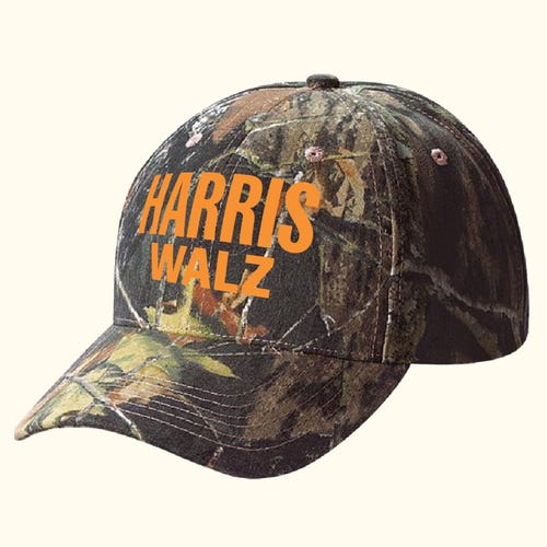 Harris-Walz logo in orange print on a camo hat