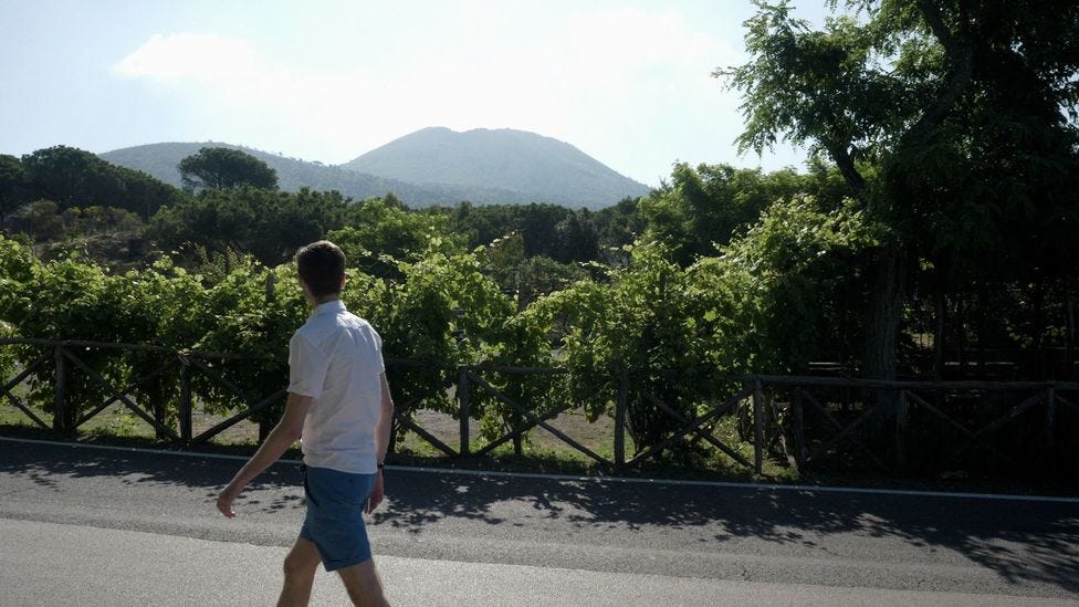 Richard Fisher walking in front of Vesuvius (Image credit: Pomona Pictures)
