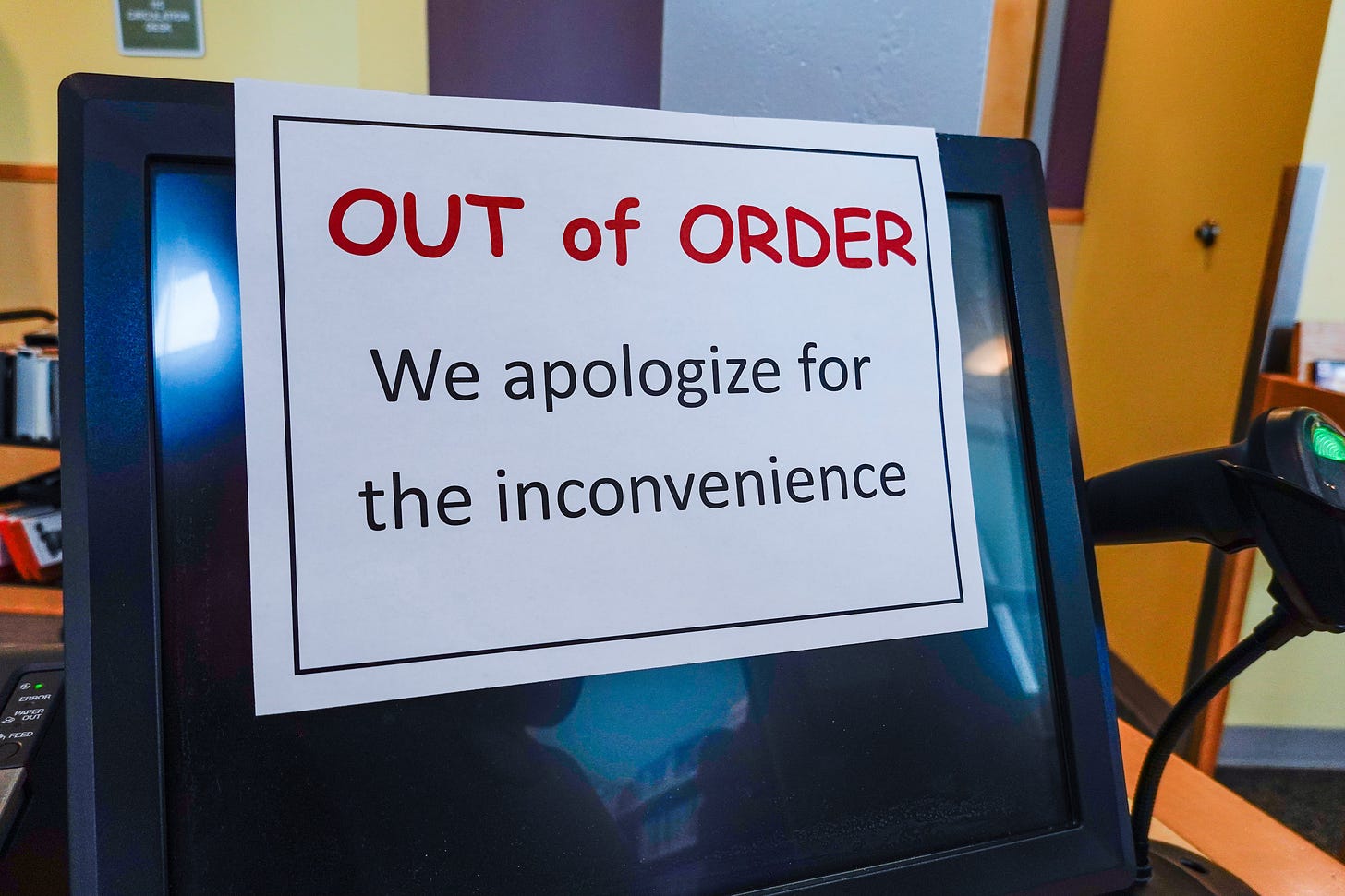 a computer screen with the sign 'out of order, we apologize for the inconvenience' 