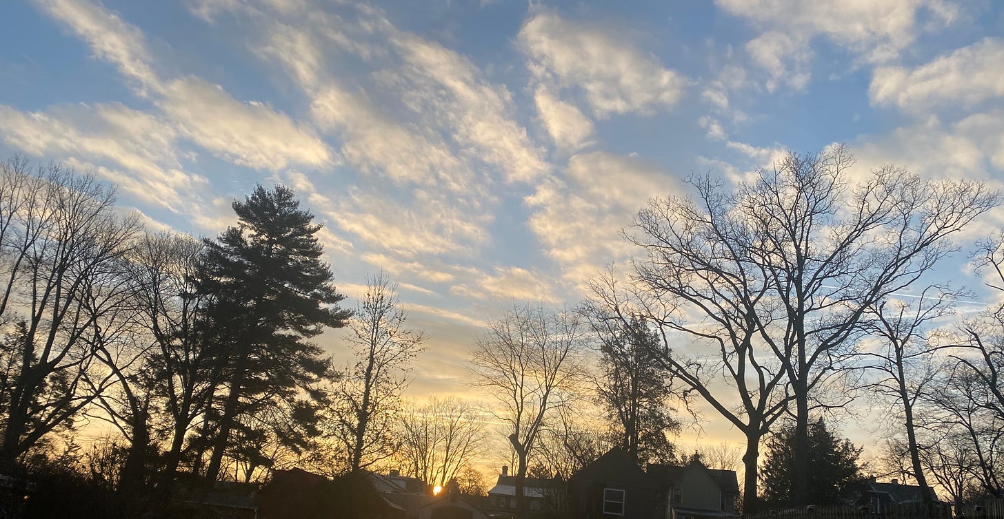 clouds in a blue sky at sunrise