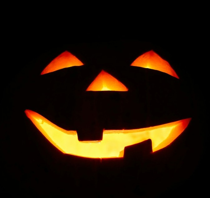 a carved jack o lantern in the dark