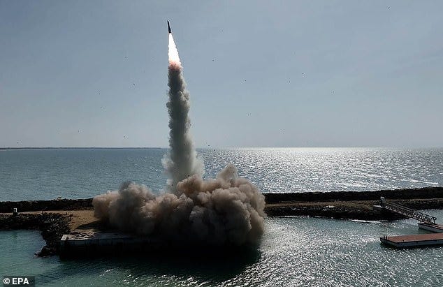 A handout photo made available by the Iranian Army office on 19 January 2024 shows a missile being launched during a military drill in the Persian Gulf, southern Iran