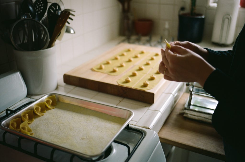 Victoria folds the pasta into shapes