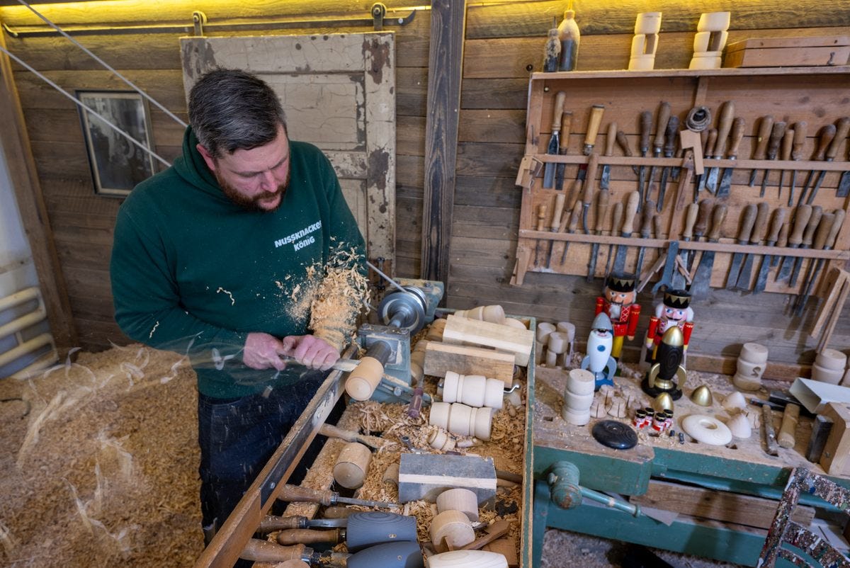 Markus Füchtner, a fifth-generation nutcracker maker, at the lathe in his family's centuries-old workshop.