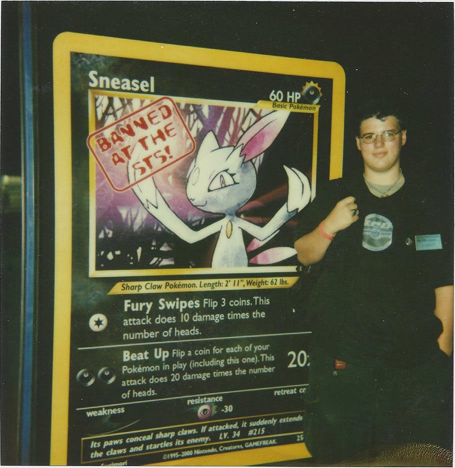 Jim standing next to a giant Sneasel card from Neo Genesis, the first Wizards of the Coast Pokémon card to be banned at a major Pokémon event