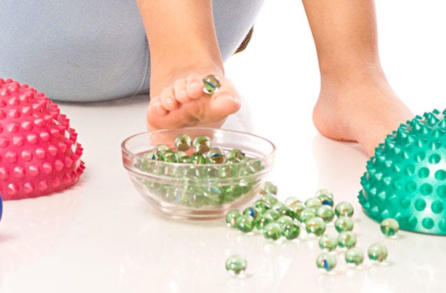 Toes picking up marbles flat feet exercise