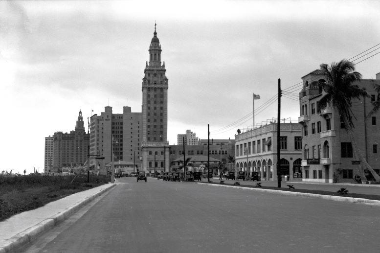 Street view which includes the Miami Daily News Tower in 1927. Courtesy of Florida State Archives.