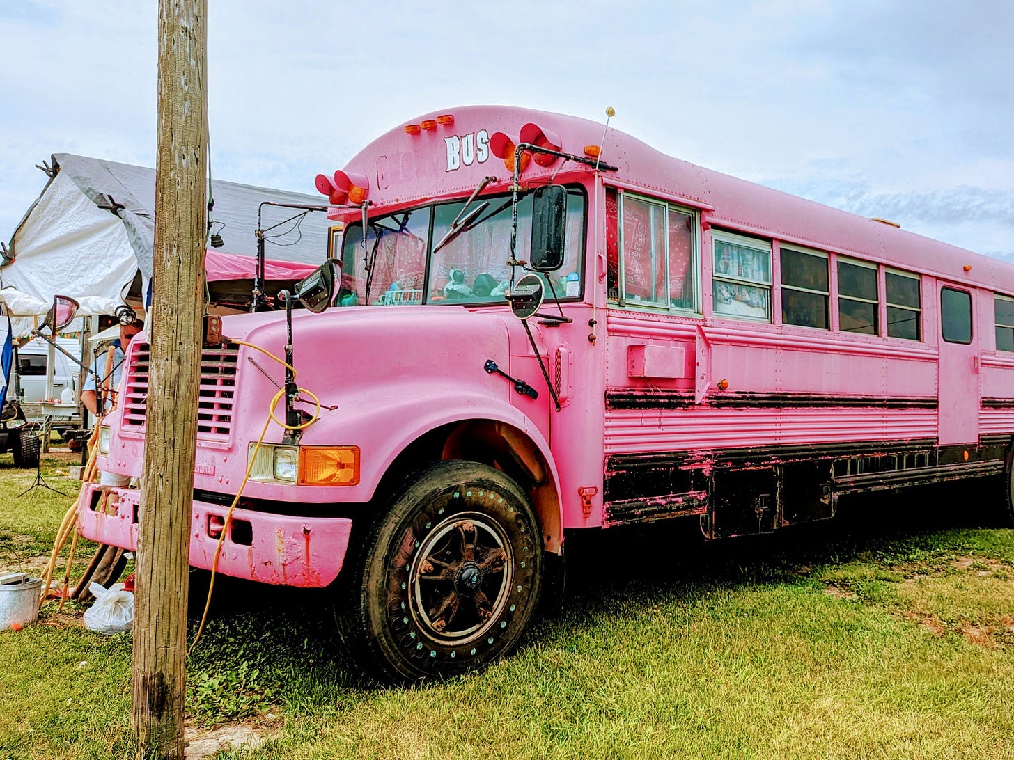 A school bus painted barbie-pink