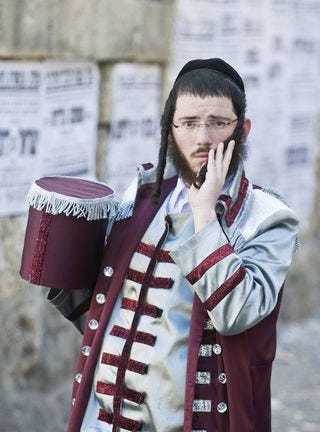 An Orthodox Jewish man wearing peyos.