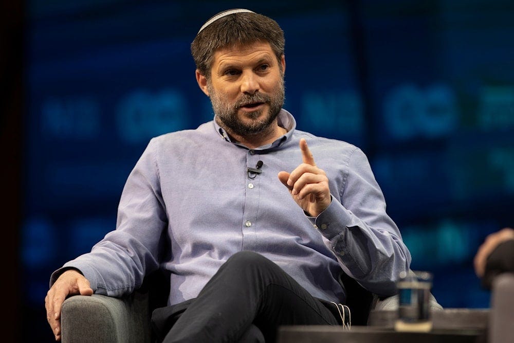 Israeli politician Betzalel Smotrich gestures as he speaks during a conference in occupied al-Quds, on March 7, 2021. (AP)