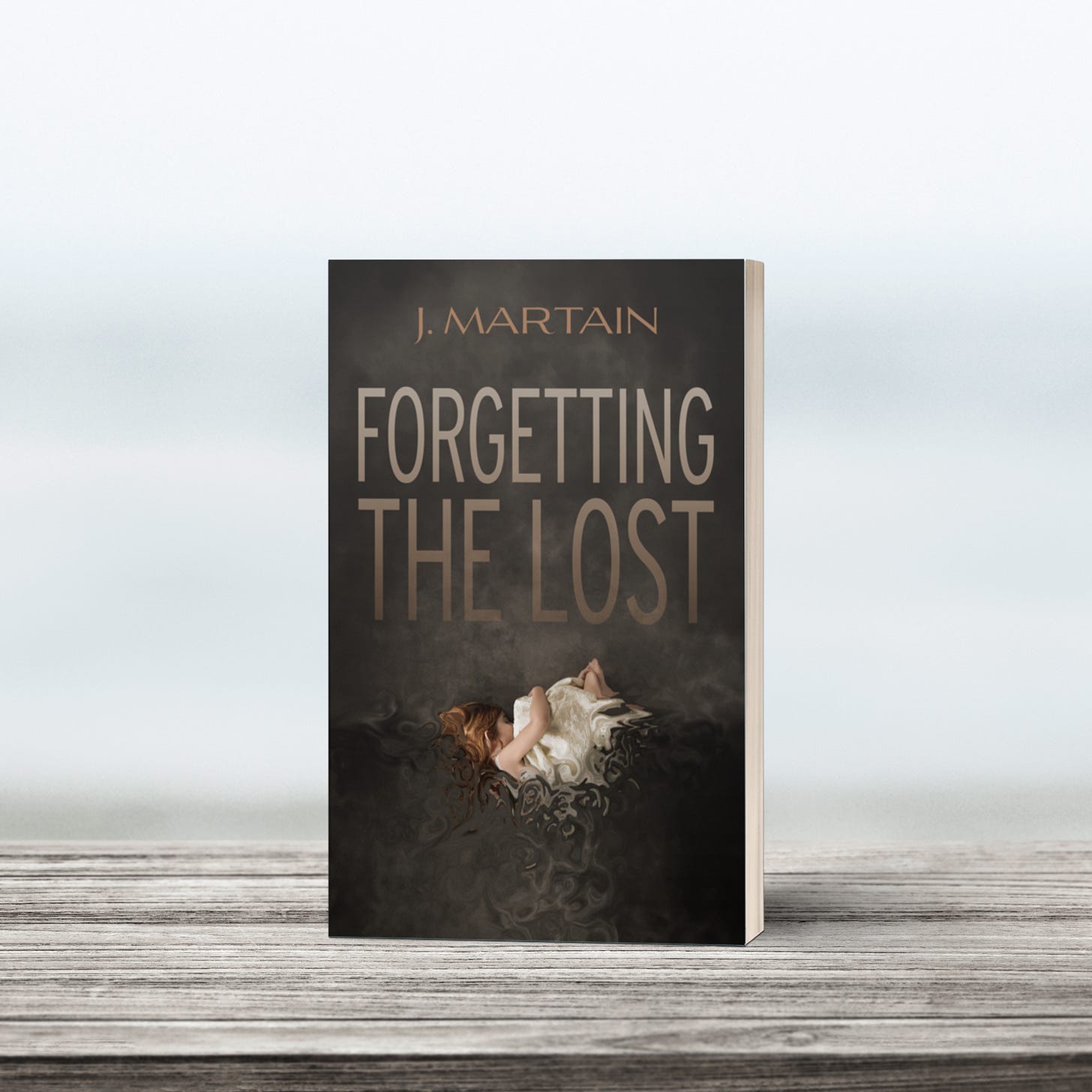 Forgetting the Lost by J. Martain paperback on moody coastal background