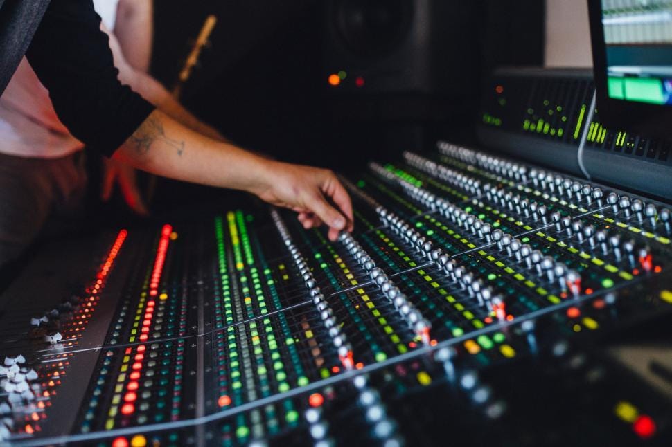 Free Stock Photo of Man Operating Sound Board in Recording Studio |  Download Free Images and Free Illustrations