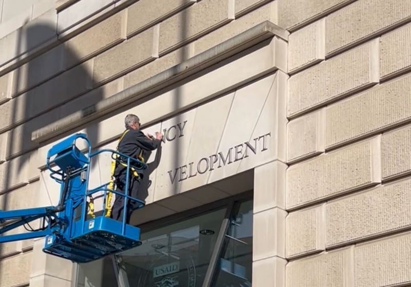 Photos: Crew Removes USAID Sign As the Agency Faces Near-Total Gutting -  Business Insider