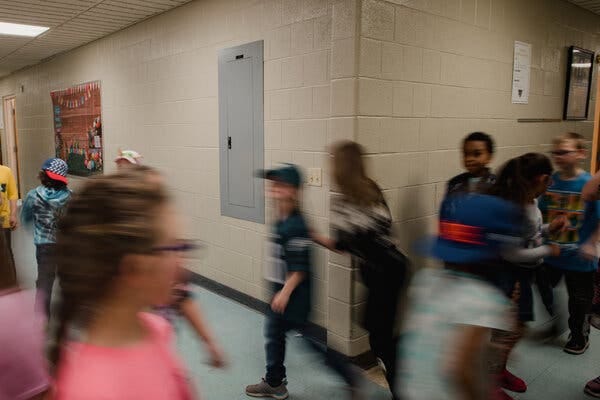 Students walking in a busy hallway at Panther Valley Elementary School.